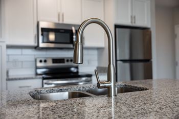 Modern finishes such as granite countertops and digital thermostats